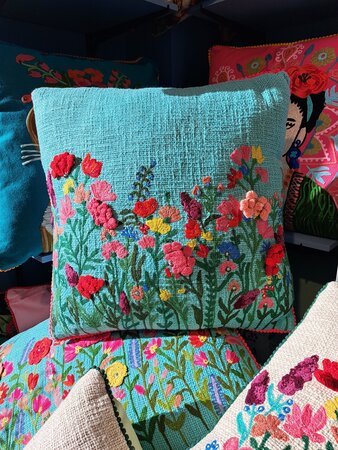 Light blue hand-woven decorative cushion with flowers 45x45